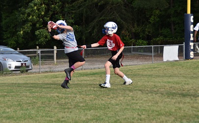 A player catching a touchdown in MARA Colts Flag Football 